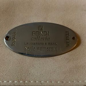 Fendi stamped metal tag